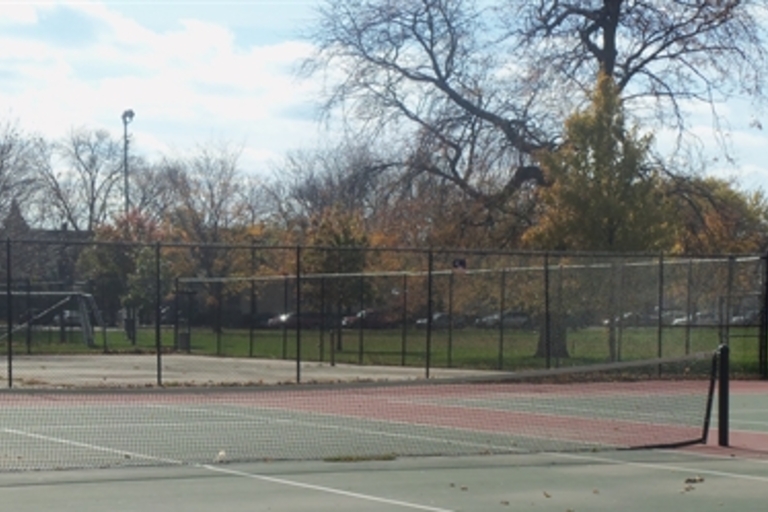 Empty tennis courts in a park in autumn.