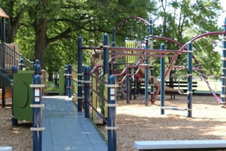 Accessible playground with ramp and climbing structures.
