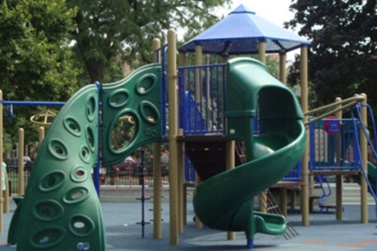 A colorful playground with slides and climbing structures.
