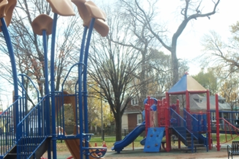 Colorful playground equipment on a fall day.
