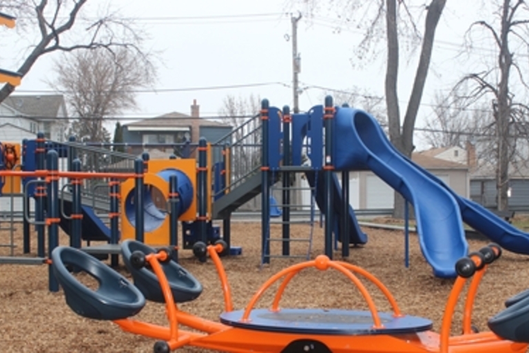 Colorful playground with slides and climbing structures.