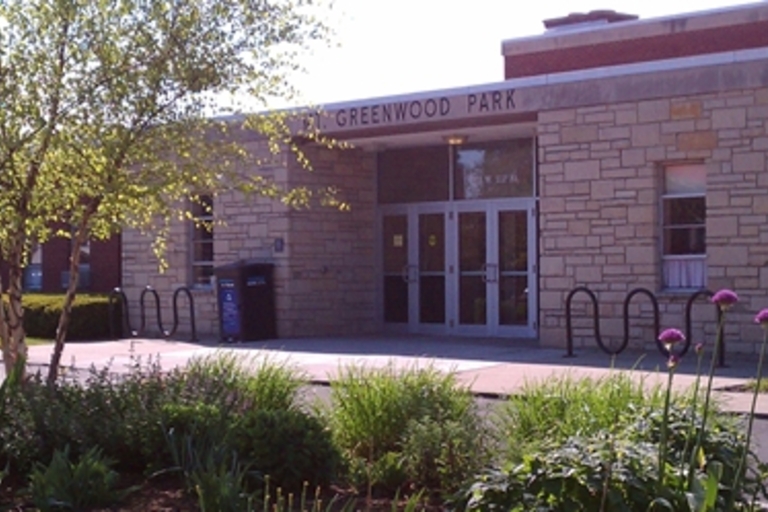Greenwood Park building entrance with landscaping.