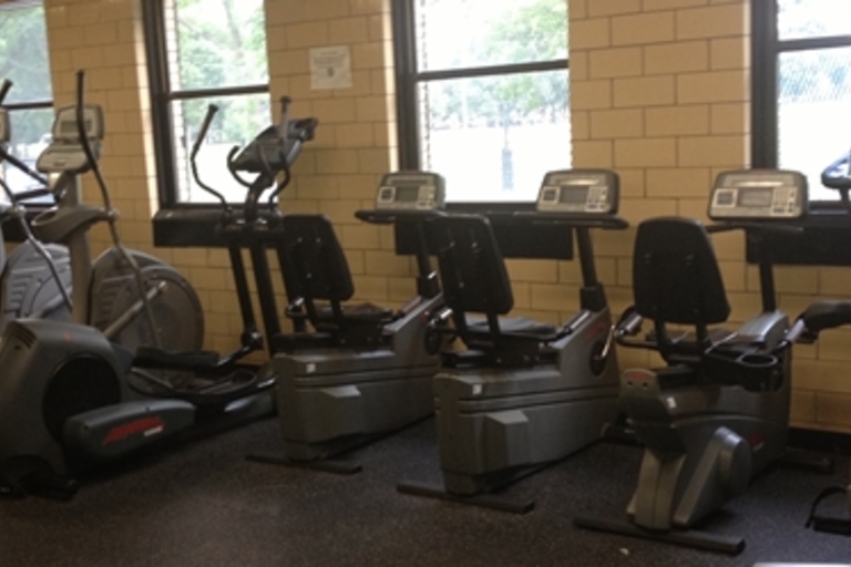 Fitness center with treadmills, ellipticals, and recumbent bikes.