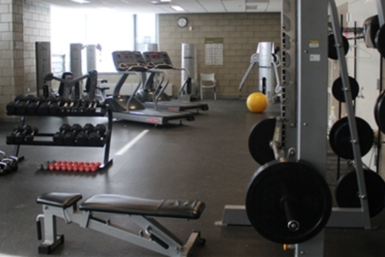 Fitness center with various exercise equipment.
