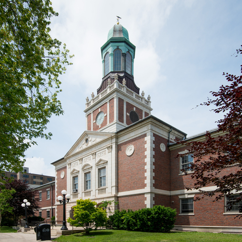 Austin Town Hall, a brick building with a clock tower and green cupola.