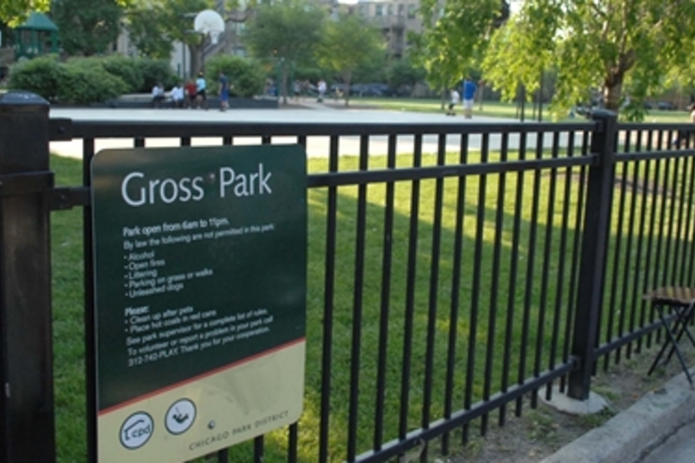 Gross Park in Chicago with a basketball court and park rules sign.