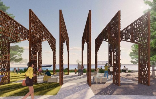 Architectural rendering of a waterfront park featuring large, rust-colored, text-covered structures. People relax on benches and stroll through the area.
