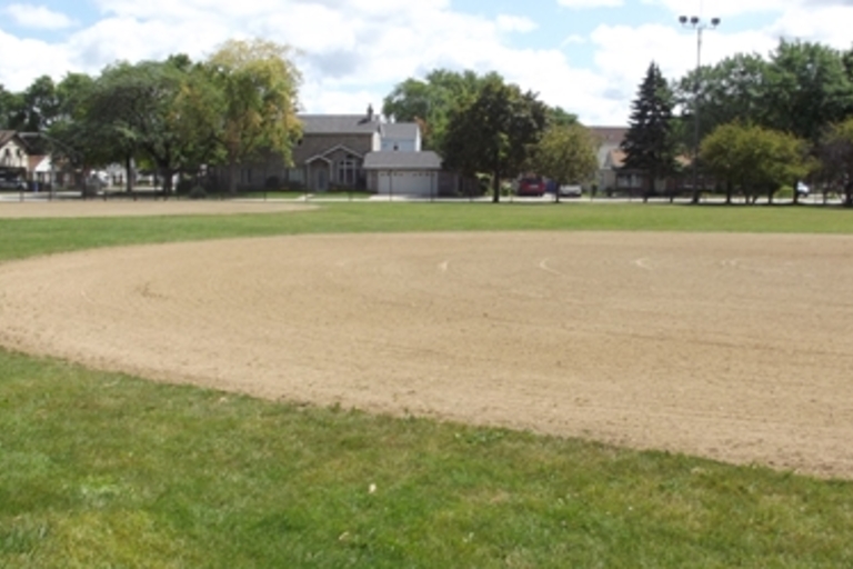 Baseball infield on a sunny day.