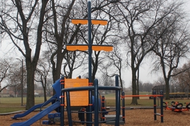 Playground with a pirate ship themed play structure.