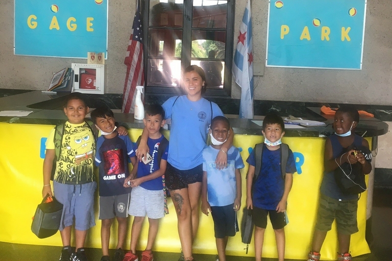 Group photo of a camp counselor and six young boys at Gage Park.