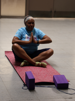 Woman meditating in a seated yoga pose.